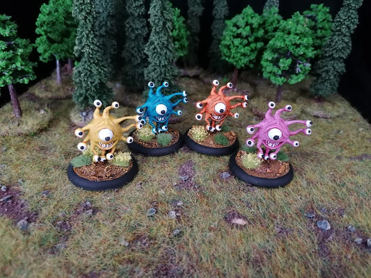 4 of Jacob's beholder miniatures painted in a variety of colours